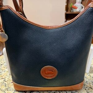 Dooney and Bourke Chic Black and Tan Leather Shoulder Bag-9 x 11 1/2 x 3”